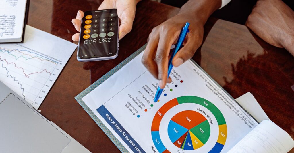 Two business professionals discussing financial documents and strategies at an office desk.